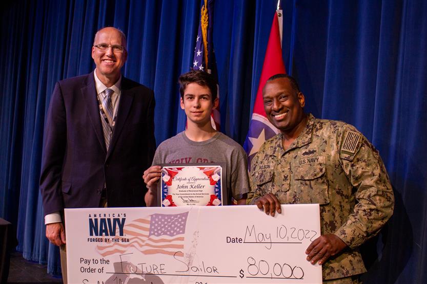 A student is honored for serving in the US Armed Forces after high school